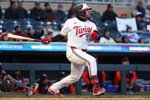 Keaschall hits a 2-run homer and the Twins hold on for a frigid 7-3 win over the Tigers