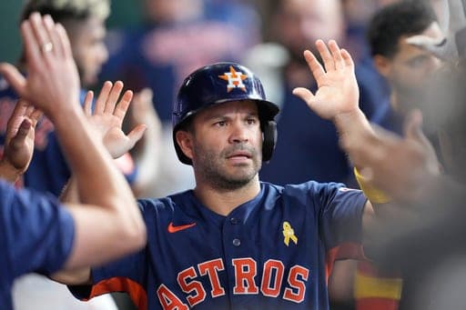 Houston Astros' Jose Altuve celebrates in the dugout after after scoring against the Arizona Diamondbacks during the eighth inning of a baseball game Sunday, Sept. 6, 2026, in Houston. (AP Photo/David J. Phillip) (AP Photo/David J. Phillip)