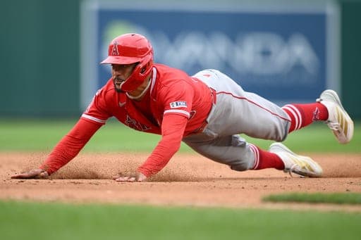 Los Angeles Angels' Jose Siri slides towards third base during the sixth inning of a baseball game against the Washington Nationals, Saturday, Sept. 12, 2026, in Washington. (AP Photo/Nick Wass) (AP Photo/Nick Wass)