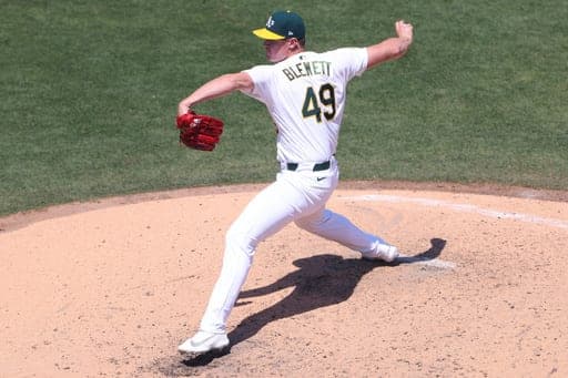 Athletics pitcher Scott Blewett throws to a Tampa Bay Rays batter during the seventh inning of a baseball game Wednesday, Aug. 12, 2026, in West Sacramento, Calif. (AP Photo/Scott Marshall) (AP Photo/Scott Marshall)