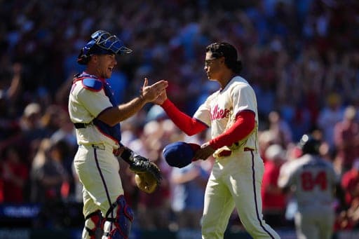 Philadelphia Phillies pitcher Jesús Luzardo, right, celebrates with J.T. Realmuto after a baseball game against the Atlanta Braves, Monday, Sept. 7, 2026, in Philadelphia. (AP Photo/Derik Hamilton) (AP Photo/Derik Hamilton)