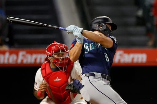 Seattle Mariners designated hitter Dominic Canzone (8) hits an RBI single during the sixth inning of a baseball game against the Los Angeles Angels, Wednesday, Sept. 16, 2026, in Anaheim, Calif. (AP Photo/Caroline Brehman) (AP Photo/Caroline Brehman)