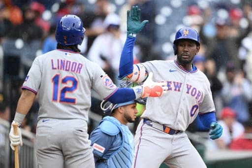 New York Mets' Ronny Mauricio (0) celebrates his solo home run with Francisco Lindor (12) during the seventh inning of a baseball game against the Washington Nationals, Saturday, Sept. 26, 2026, in Washington. (AP Photo/Nick Wass) (AP Photo/Nick Wass)