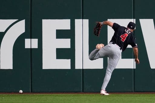 Washington Nationals left fielder Daylen Lile (4) chases after a Texas Rangers' Ezequiel Duran triple in the eighth inning of a baseball game Thursday, Aug. 20, 2026, in Arlington, Texas. (AP Photo/Tony Gutierrez) (AP Photo/Tony Gutierrez)