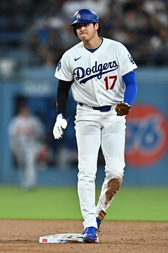 Los Angeles Dodgers' Shohei Ohtani gestures after stealing second base during the second inning of a baseball game against the St. Louis Cardinals, Wednesday, Sept. 2, 2026, in Los Angeles. (AP Photo/William Liang) (AP Photo/William Liang)