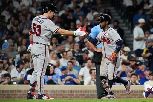 Atlanta Braves' Ozzie Albies, right, celebrates with Brewer Hicklen after hitting a two-run home run during the seventh inning of a baseball game against the Chicago Cubs in Chicago, Tuesday, Sept. 15, 2026. (AP Photo/Nam Y. Huh) (AP Photo/Nam Y. Huh)