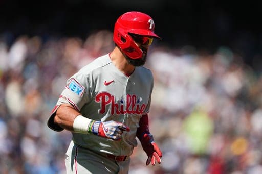 Philadelphia Phillies' Kyle Schwarber jogs the bases after hitting a three-run home run against Seattle Mariners starting pitcher Bryan Woo during the second inning of a baseball game, Wednesday, Aug. 26, 2026, in Seattle. (AP Photo/Lindsey Wasson) (AP Photo/Lindsey Wasson)
