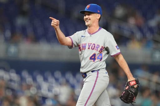 New York Mets pitcher Austin Warren (44) points towards the dugout after the final out against the Miami Marlins in a baseball game, Monday, Sept. 7, 2026, in Miami. (AP Photo/Lynne Sladky) (AP Photo/Lynne Sladky)