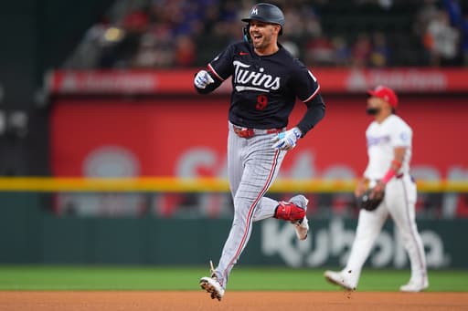 Larnach leads off with homer and Twins go on to 12-2 win to clinch another series in Texas
