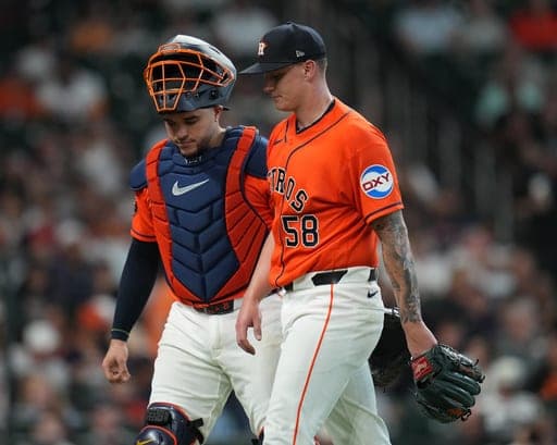 Houston Astros starting pitcher Hunter Brown (58) walks back to the dugout with catcher Yainer Diaz after getting out of a bases loaded situation during the fourth inning of a baseball game against the Seattle Mariners, Sunday, Aug.16, 2026, in Houston. (AP Photo/Karen Warren) (AP Photo/Karen Warren)