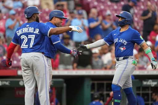 Springer goes deep twice as Blue Jays hold off Reds, 12-9