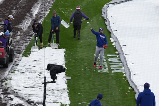 A mid-April snowstorm coats Coors Field as Dodgers-Rockies series gets off to frosty start