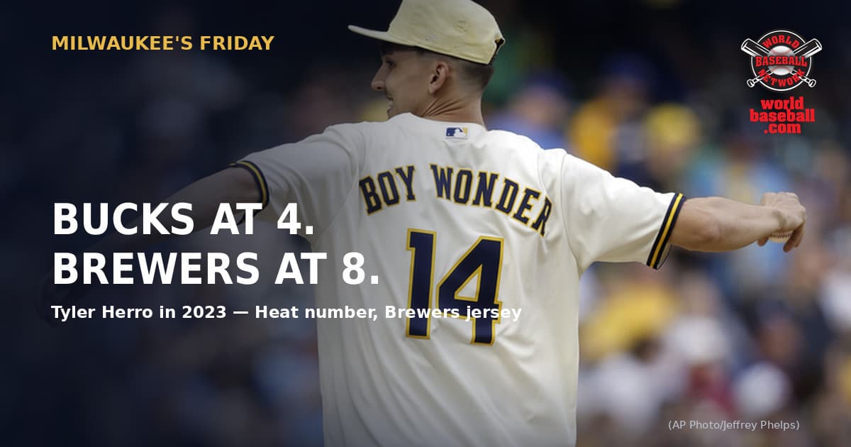 Tyler Herro throws a ceremonial first pitch at American Family Field in a cream Brewers jersey reading BOY WONDER with the number 14 on the back.