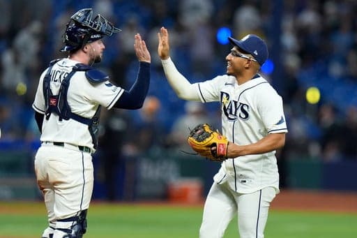 Tampa Bay Rays' Richie Palacios, right, and Liam Hicks celebrate a victory over the New York Yankees in Game 2 of an American League Division Series baseball game Monday, Oct. 5, 2026, in St. Petersburg, Fla. (AP Photo/Chris O'Meara) (AP Photo/Chris O'Meara)
