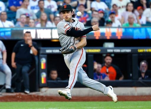 San Francisco Giants third baseman Shay Whitcomb throws out New York Mets' Francisco Alvarez at first base during the ninth inning of a baseball game, Saturday, Sept. 5, 2026, in New York. (AP Photo/Noah K. Murray) (AP Photo/Noah K. Murray)