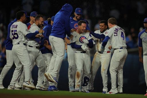 Chicago Cubs' Alex Bregman celebrates with his teammates after his game winning hit during the ninth inning of a baseball game against the Chicago White Sox, Tuesday, Aug. 18, 2026, in Chicago. (AP Photo/Melissa Tamez) (AP Photo/Melissa Tamez)