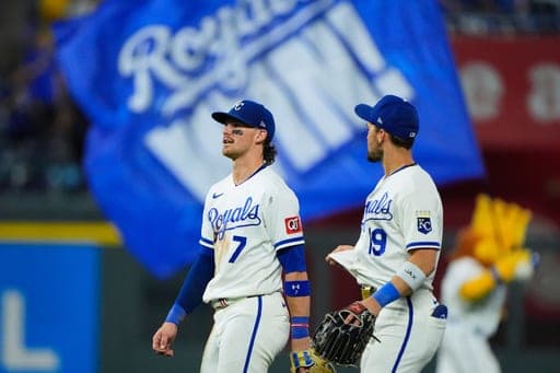 Kansas City Royals' Bobby Witt Jr. (7) and Michael Massey (19) celebrate after their baseball game against the Athletics, Monday, Aug. 17, 2026, in Kansas City, Mo. (AP Photo/Charlie Riedel) (AP Photo/Charlie Riedel)