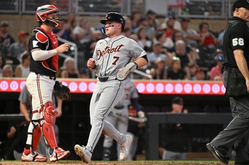 Detroit Tigers' Kevin McGonigle (7) scores as he runs past Minnesota Twins catcher Ryan Jeffers during the fifth inning of a baseball game Wednesday, Sept. 2, 2026, in Minneapolis. (AP Photo/Craig Lassig) (AP Photo/Craig Lassig)