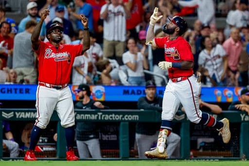Atlanta Braves' Michael Harris II, right, celebrates his two-run home run with third base coach Tommy Watkins during the fifth inning of a baseball game against the Colorado Rockies, Friday, Aug. 28, 2026, in Atlanta. (AP Photo/Erik S. Lesser) (AP Photo/Erik S. Lesser)