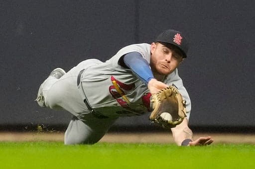 St. Louis Cardinals' Nathan Church makes a diving catch during the seventh inning of a baseball game against the Milwaukee Brewers, Friday, Sept. 25, 2026, in Milwaukee. (AP Photo/Aaron Gash) (AP Photo/Aaron Gash)
