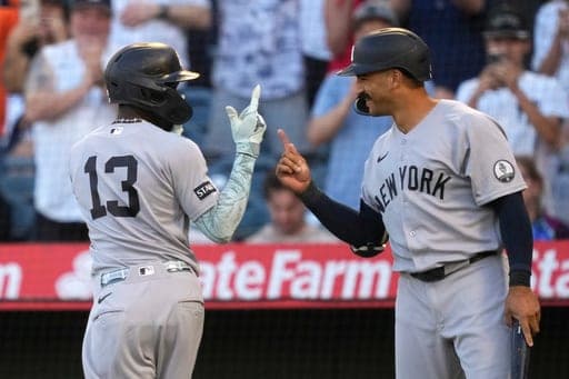 New York Yankees' Jazz Chisholm Jr., left, is congratulated by Trent Grisham after hitting a solo home run during the first inning of a baseball game against the Los Angeles Angels, Tuesday, Sept. 1, 2026, in Anaheim, Calif. (AP Photo/Mark J. Terrill) (AP Photo/Mark J. Terrill)