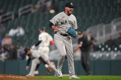 New York Yankees relief pitcher John Schreiber celebrates after forcing the final out of a baseball game against the Minnesota Twins, Monday, Sept. 14, 2026, in Minneapolis. (AP Photo/Abbie Parr) (AP Photo/Abbie Parr)