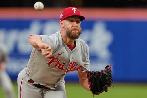 Hill makes incredible grab as Wheeler pitches Phillies to 2-1 win after Mets fire manager
