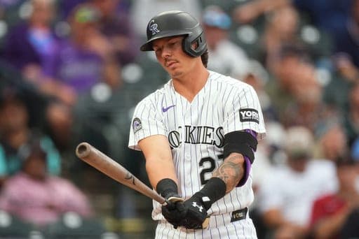 Colorado Rockies' Jordan Beck reacts after striking out against Arizona Diamondbacks relief pitcher Kevin Ginkel in the ninth inning of a baseball game Thursday, Sept. 24, 2026, in Denver. (AP Photo/David Zalubowski) (AP Photo/David Zalubowski)