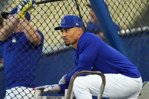 Los Angeles Dodgers' Mookie Betts waits by the batting cage during a workout ahead of Game 3 of baseball's National League Championship Series against the Milwaukee Brewers, Tuesday, Oct. 13, 2026, in Los Angeles. (AP Photo/Jae C. Hong) (AP Photo/Jae C. Hong)