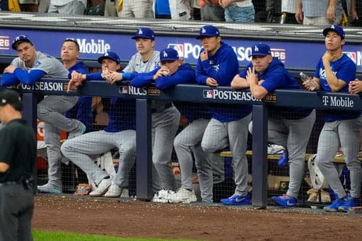 The Los Angeles Dodgers watch the final out of Game 2 of baseball's National League Championship Series between the Milwaukee Brewers and the Los Angeles Dodgers, Monday, Oct. 12, 2026, in Milwaukee. (AP Photo/Kayla Wolf) (AP Photo/Kayla Wolf)