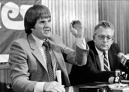 FILE - Phillies president Bill Giles looks on as first baseman Pete Rose gestures as he talks about his one-year, $1.2 million contract, at a news conference in Philadelphia, Pa., on November 2, 1982. (AP Photo/Al Schell,File) (AP Photo/Al Schell)