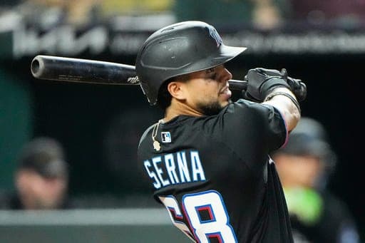 Miami Marlins' Jared Serna watches his sacrifice fly to score one run during the sixth inning of a baseball game against the Kansas City Royals, Wednesday, Sept. 2, 2026, in Kansas City, Mo. (AP Photo/Charlie Riedel) (AP Photo/Charlie Riedel)