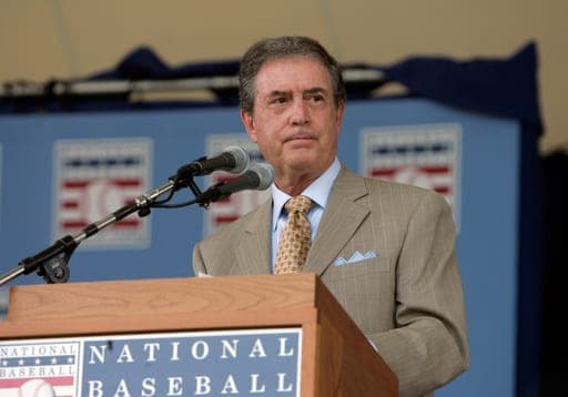 FILE - Kansas City Royals broadcaster Denny Matthews speaks after receiving the Ford C. Frick Award for broadcasting excellence during the National Baseball Hall of Fame Induction Ceremony in Cooperstown, N.Y. Sunday, July 29, 2007. (AP Photo/Mike Groll, File) (AP Photo/Mike Groll)