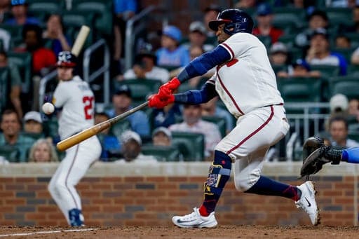 Atlanta Braves' Ozzie Albies (1) hits an RBI single against the Los Angeles Dodgers during the eighth inning of a baseball game, Tuesday, Aug. 25, 2026, in Atlanta. (AP Photo/Erik S. Lesser) (AP Photo/Erik S. Lesser)