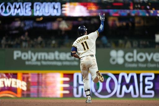 Milwaukee Brewers' Jackson Chourio gestures as he rounds the bases after hitting a two-run home during the ninth inning of a baseball game against the Chicago Cubs, Tuesday, Sept. 8, 2026, in Milwaukee. (AP Photo/Aaron Gash) (AP Photo/Aaron Gash)