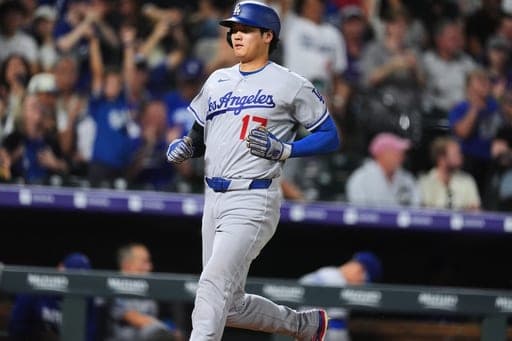 Los Angeles Dodgers' Shohei Ohtani scores on a double hit by Freddie Freeman off Colorado Rockies relief pitcher TJ Shook in the eighth inning of a baseball game Monday, Aug. 17, 2026, in Denver. (AP Photo/David Zalubowski) (AP Photo/David Zalubowski)