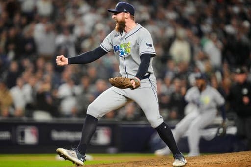 Tampa Bay Rays pitcher Bryan Baker celebrates the team's win in Game 3 of baseball's American League Division Series against the New York Yankees, Wednesday, Oct. 7, 2026, in New York. (AP Photo/Yuki Iwamura) (AP Photo/Yuki Iwamura)