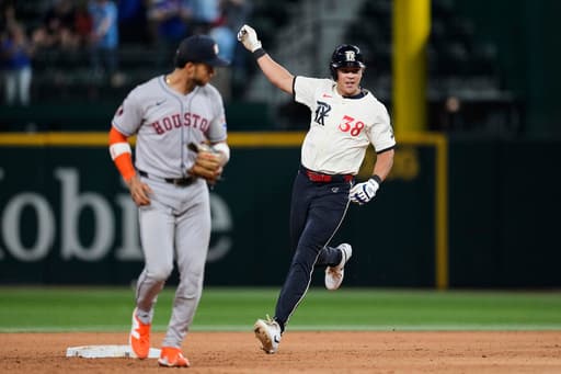 Rangers outlast AL West-leading Astros 4-3 in 12 innings to move closer to playoff spot