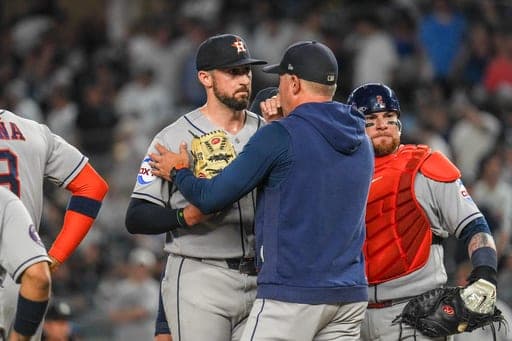 Houston Astros pitcher Bennett Sousa (62) receives a mound visit after New York Yankees left fielder Cody Bellinger hit an RBI double during the seventh inning of a baseball game against the New York Yankees Wednesday, Aug. 26, 2026, in New York. (AP Photo/Ryan Murphy) (AP Photo/Ryan Murphy)