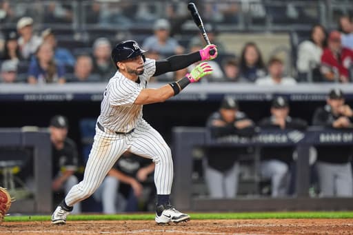 Yankees rally past White Sox 3-2, clinch playoff berth and close within 1 game of Toronto in AL East
