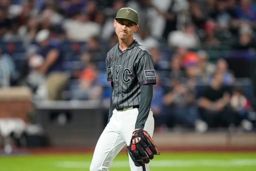 Weaver’s fib: Tells injured Holmes he had name written in cap because `it just felt right to say’