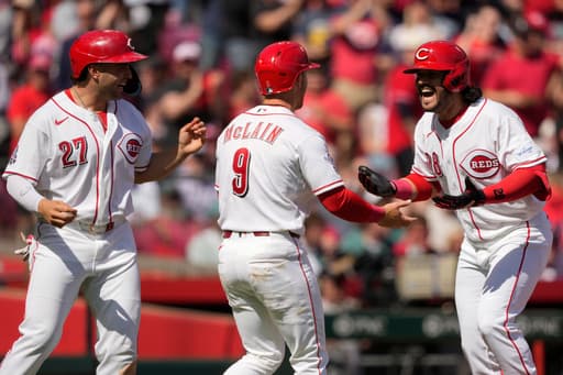 Eugenio Suarez hits a 3-run homer and Reds beat Red Sox 3-2 to win season-opening series