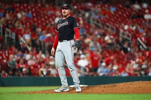 Washington Nationals starting pitcher Cade Cavalli reacts after striking out St. Louis Cardinals' Bryan Torres during the fourth inning of a baseball game Friday, Sept. 18, 2026, in St. Louis. (AP Photo/Scott Kane) (AP Photo/Scott Kane)