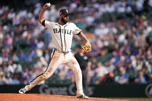Seattle Mariners third baseman Weston Wilson, pitching in relief, throws against the Chicago Cubs during the ninth inning of a baseball game, Sunday, Aug. 23, 2026, in Seattle. (AP Photo/Lindsey Wasson) (AP Photo/Lindsey Wasson)