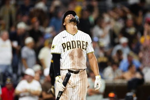 San Diego Padres' Xander Bogaerts reacts after lining out against the Pittsburgh Pirates in the eleventh inning of a baseball game Monday, Aug. 24, 2026, in San Diego. (AP Photo/Derrick Tuskan) (AP Photo/Derrick Tuskan)