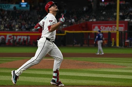 Arizona Diamondbacks' Nolan Arenado rounds third base after hitting a home run during the seventh inning of a baseball game against the Texas Rangers, Sunday, Sept. 13, 2026, in Phoenix. (AP Photo/Caitlin O'Hara) (AP Photo/Caitlin O'Hara)