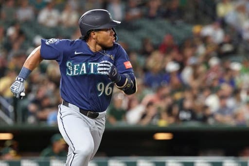 Seattle Mariners' Michael Arroyo runs after hitting a double, first major-league hit, during the fourth inning of a baseball game against the Athletics Saturday, Sept. 12, 2026, in West Sacramento, Calif. (AP Photo/Sara Nevis) (AP Photo/Sara Nevis)