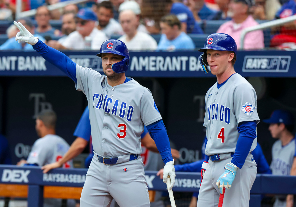 Cubs hitters Alex Bregman and Pete Crow-Armstrong in the on-deck circle.