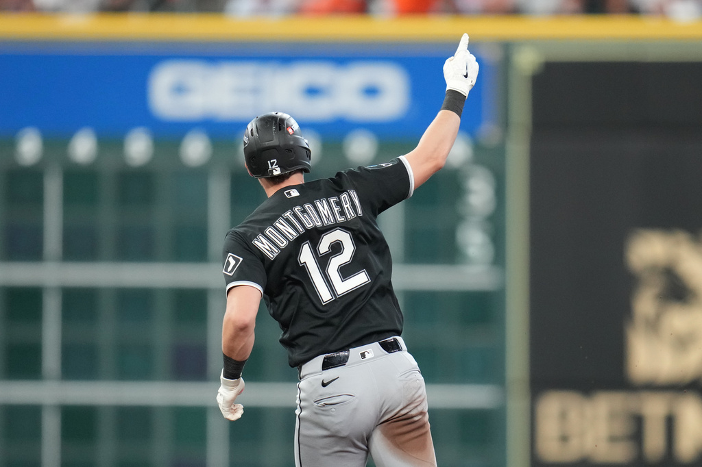 Chicago White Sox's Colson Montgomery (12) runs the bases after hitting a solo home run during the fourth inning in Game 1 