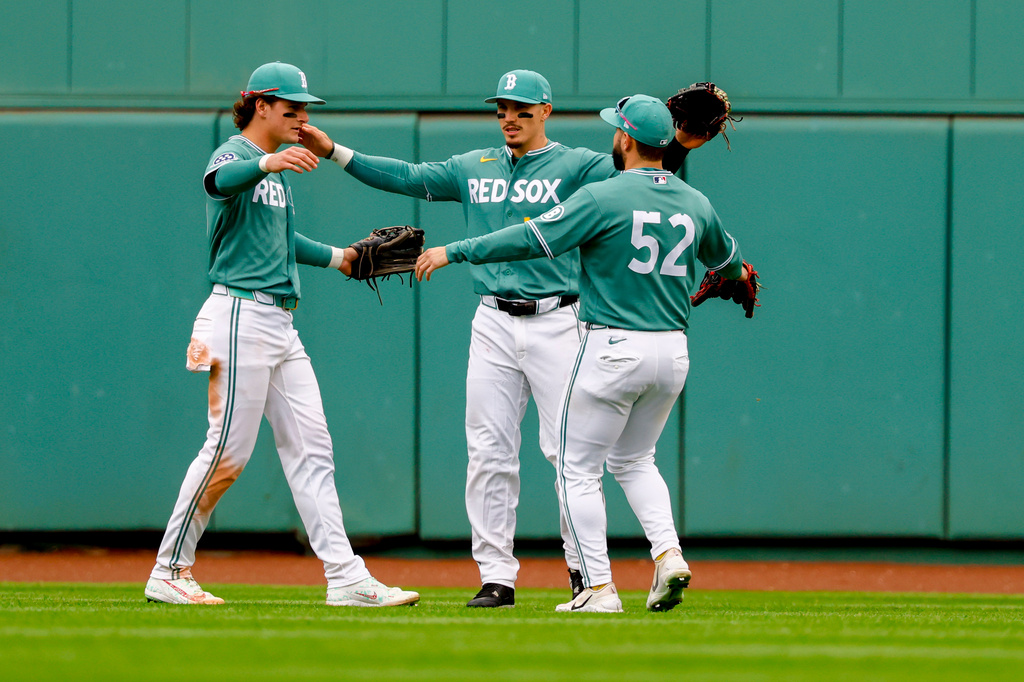Red Sox outfielders Roman Anthony, Jarren Duran and Wilyer Abreu celebrate a win over the Cubs.